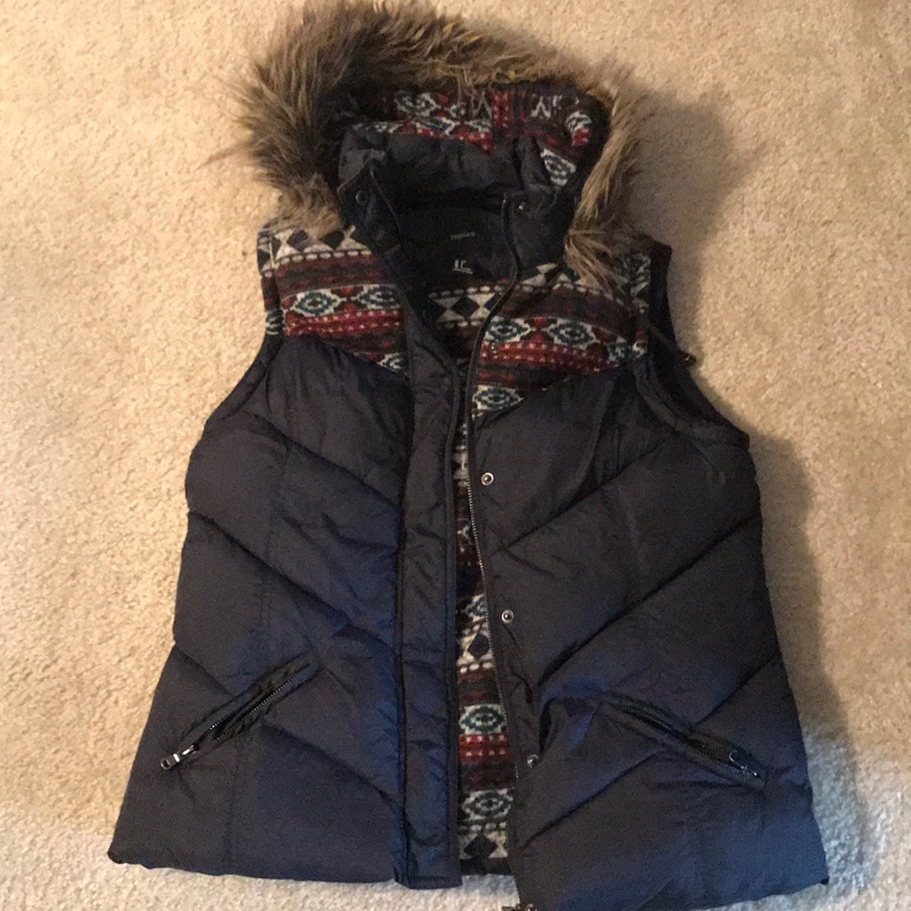 Puffer vest with a fur hood